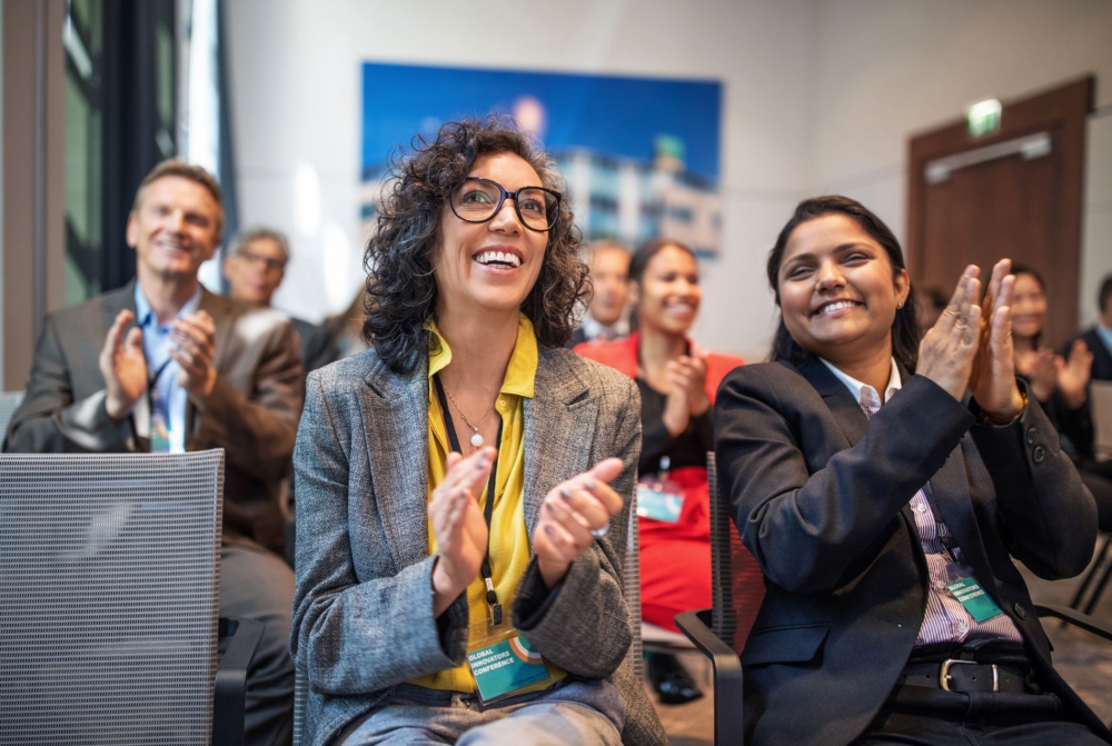 Women clapping after presentation